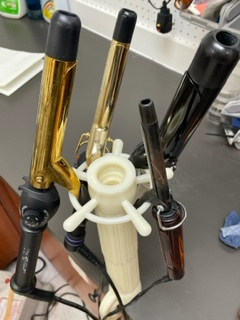 SWIVEL CLAMP: MULTI-FUNCTIONAL: HOLDS BLOCKS FOR STYLING WIGS AND PIECES/CONVENIENTLY HOLDS CURLING IRONS.